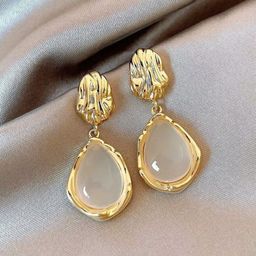 PASU FASHION Gold-Plated Artificial Stones Studded Teardrop Shaped Drop Earrings-32