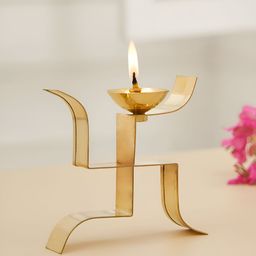 DecorTwist Gold toned Brass Swastik Pooja Diya-image-92