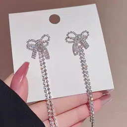 VAGHBHATT Silver-Plated Rhinestones Studded Bow Shaped Drop Earrings-10