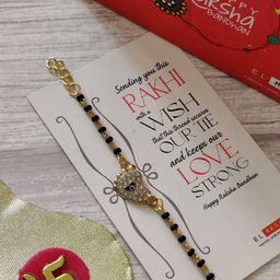 EL REGALO Kids Gold-Toned Nazaria Rakhi Combo with Greeting Card & Roli Chawal Shagun-image-79