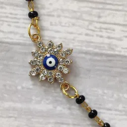 EL REGALO Kids Gold-Toned Nazaria Rakhi Combo with Greeting Card & Roli Chawal Shagun-image-69