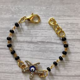 EL REGALO Kids Gold-Toned Nazaria Rakhi Combo with Greeting Card & Roli Chawal Shagun-image-62