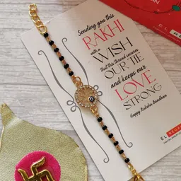 EL REGALO Kids Gold-Toned Nazaria Rakhi Combo with Greeting Card & Roli Chawal Shagun-image-63