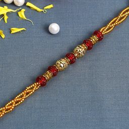 Aapno Rajasthan Red and Gold-Toned Twisted Spiral Jewelled Rakhi-image-41