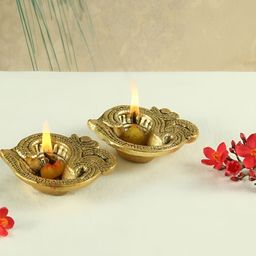 HANDICRAFTS PARADISE Gold Toned 2 Pcs Om Designed Antique Metal Pooja Diyas-44