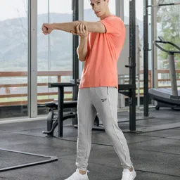 Reebok Men Grey Melange Solid Joggers with Side Piping-image-35