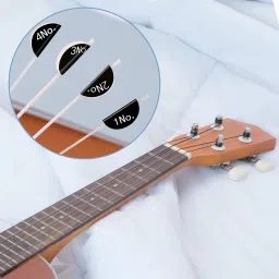 mocking bird Ukulele String Set High Quality Nylon String With Picks And Guitar Capo Concert Ukelele Strings image 2