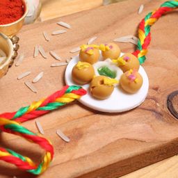 Aapno Rajasthan Kids Yellow Sweet Dish Rakhi-image-31