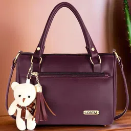LOREM Structured Handheld Bag with Tasselled image 1
